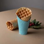 Grease-resistant waffle cone sleeve for ice cream